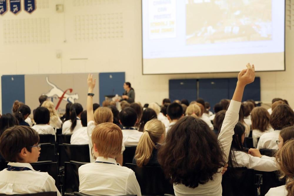 Canadian students taking part in an exercise to urge Justin Trudeau to sign the Safe Schools Declaration and help end attacks on and military use of schools.