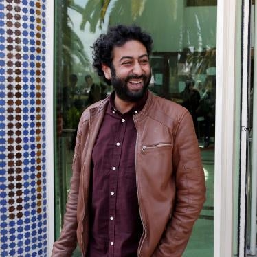 Journalist and activist Omar Radi waits outside the court in Casablanca, Morocco, March 12, 2020.