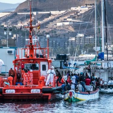 Men disembark from a wooden boat at the Arguineguín pier, on Gran Canaria, one of Spain’s Canary Islands, after a dangerous journey in the Atlantic Ocean.