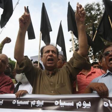 Pakistani journalists hold nationwide protests to denounce rampant censorship, and hold a banner that reads: "black day," in Karachi, Pakistan, July 16, 2019.
