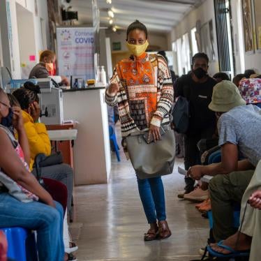Volunteers wait to be checked at a vaccine trial facility set at Soweto's Chris Sani Baragwanath Hospital outside Johannesburg, South Africa, November 30, 2020. 