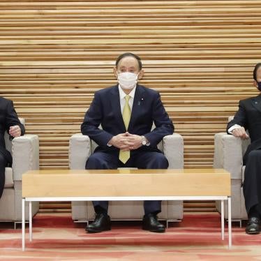 Japanese Foreign Minister Toshimitsu Motegi (left), Prime Minister Yoshihide Suga (center), and Finance Minister Taro Aso (right) attend a Cabinet meeting in Tokyo on February 24, 2021.
