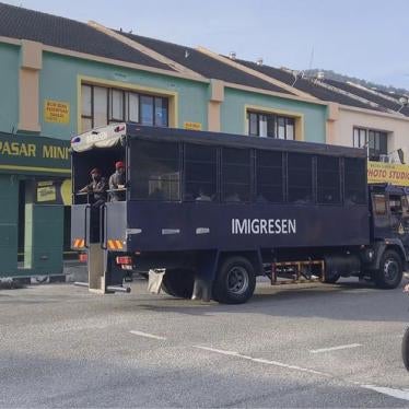 Image taken from a video of an immigration truck with security guards and unidentified people on the road to Lumut Naval Base on Tuesday, February 23, 2021 in Lumut, Malaysia. 