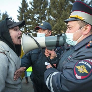 A woman argues with a police officer during a protest in support of jailed opposition leader Alexei Navalny in Ulan-Ude, Russia, April 21, 2021.