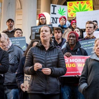 Supporters of the Marijuana Regulation and Taxation Act (MRTA) rally on the steps of New York City Hall with signs