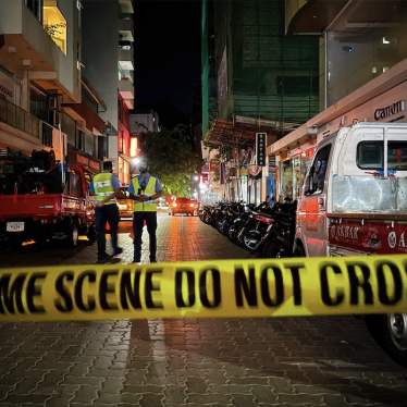Maldivian police officers secure the area following a blast in Male, Maldives, Thursday, May 6, 2021. Maldives' first democratically elected president and current Parliament Speaker Mohamed Nasheed has been injured in a blast Thursday near his home and was being treated in a hospital in the capital, police said. (