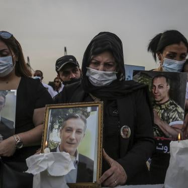 Family members of those killed in the 4th of August massive Beirut port explosion take part in a vigil to mark nine months since the blast.