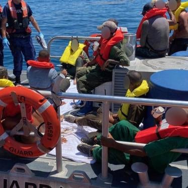 A Coast Guard Station Marathon boat crew and 15 migrants aboard 45-foot Response Boat-Medium near Big Pine Key, Florida on July 3, 2021. Photo by Petty Officer 3rd Class Ryan Estrada. Source: United States Coast Guard