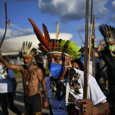 Indigenous people protest against a bill on the demarcation of indigenous land, on the roof of the National Congress, on June 8 2021, in Brasilia, Brazil. Photo: Mateus Bonomi/AGIF (via AP)
