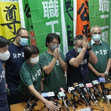 Hong Kong Confederation of Trade Unions President Joe Wong Nai-yuen, third from right, with other members before a news conference on the possibility of disbanding, Hong Kong