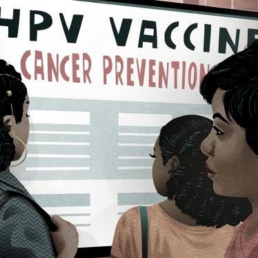 Women looking at a sign about HPV Vaccine