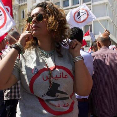A woman in sunglasses at a protest