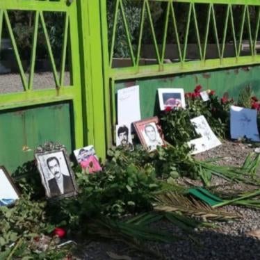 Photos of victims at a memorial commemorating those killed during the mass executions in the 1980s, Khavaran cemetery in Tehran, Iran, 2020.