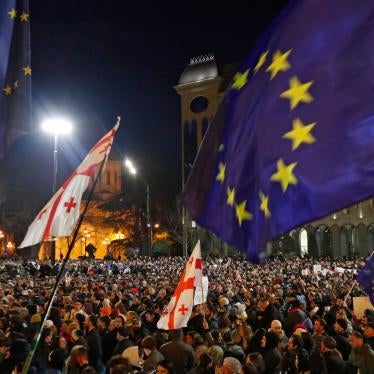 People take part in a rally to protest against the adoption of the so-called 'Foreign Agents Law' in front of Parliament building in Tbilisi.