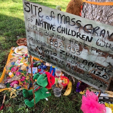 A makeshift memorial under a tree