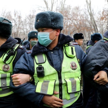 Police are deployed as people gather in support of a detained journalist, outside the Ministry of Interior Affairs in Bishkek, Kyrgyzstan, January 23, 2022. 