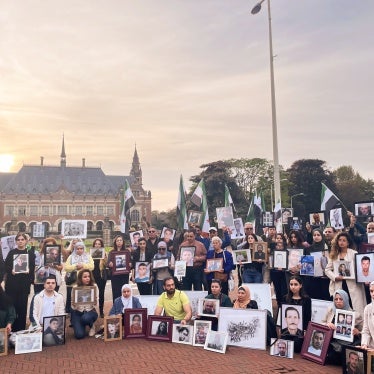 Relatives of Syrians who have been detained or disappeared protest in front of the International Court of Justice in The Hague, Netherlands, on October 10, 2023. 