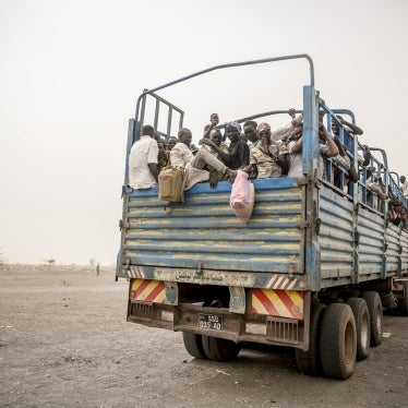 Refugees are taken in trucks