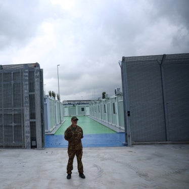 A member of the Italian Army stands in front of an immigration detention camp built by Italy in Gjader, Albania, October 11, 2024. 