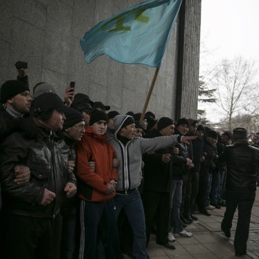 Crimean Tatars holding their flag during rallies near the Crimean parliament building on February 26, 2014, in the early days of Russia’s invasion of Crimea. 