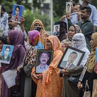 Family members of victims of enforced disappearance allegedly committed by government agencies during the rule of the Awami League hold portraits of their relatives while asking for their return in front of the Shaheed Minar, Bangladesh, August 11, 2024. 
