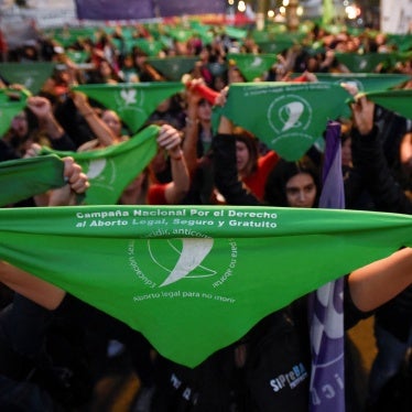 People hold green handkerchiefs during a demonstration in support of safe and legal abortion access to mark International Safe Abortion Day, in Buenos Aires, Argentina, September 28, 2023.