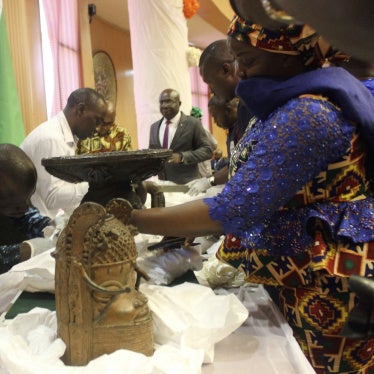 Benin bronzes looted in the past and returned to Nigeria by Germany are examined during a handing over ceremony in Abuja, December 20, 2022. 