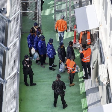 Migrants entering a detention center for processing at the port of Shengjin, northwestern Albania, January 28, 2025.