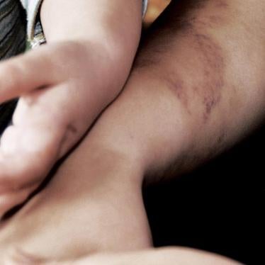 A woman and child at a shelter for victims of domestic violence in Hungary, October 10, 2013.