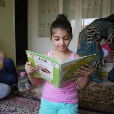 Maya, 9, reads a school textbook in her family home. She enjoys attending her local public school in izmir, on turkey’s west coast, where she is one of four Syrian students in her class.