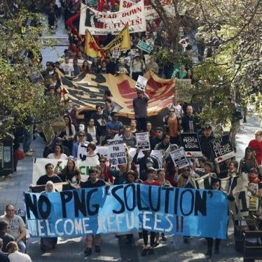 Hundreds of demonstrators march through Pitt street during a rally in support of asylum seekers in central Sydney August 10, 2013.