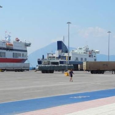 Trucks of the sort unaccompanied migrant children stow away on hoping to reach Italy, ready to be loaded onto ships at the Patras port. Children stow away between the axles, inside fuel tanks, or inside refrigerated containers.