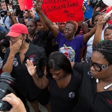 Community members attend a vigil in memory of Alton Sterling, who was shot dead by police, at the Triple S Food Mart in Baton Rouge, Louisiana, U.S. July 6, 2016.