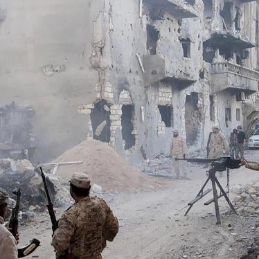 Members of the Libyan National Army, the armed forces allied with the Interim Government in al-Bayda, during clashes with the Benghazi Revolutionaries Shura Council, an Islamist militia alliance , in Benghazi on April 1, 2015. 