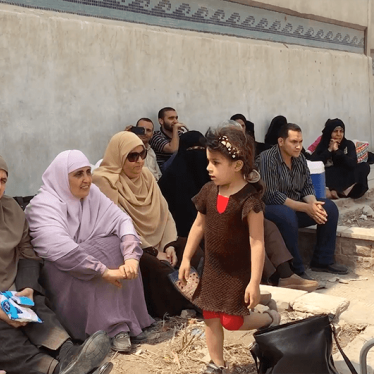 Picture of families protesting outside of Scorpion prison in Egypt.