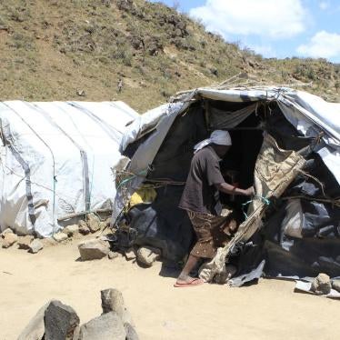 A woman displaced in the violence following the 2007 elections enters a makeshift shelter at the camp for internally displaced people in Naivasha October 8, 2014.