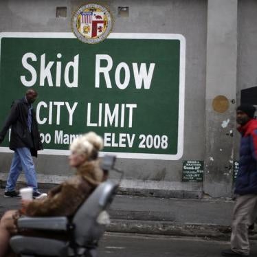 People view a memorial for a man killed by police on skid row in Los Angeles, California, March 2, 2015.