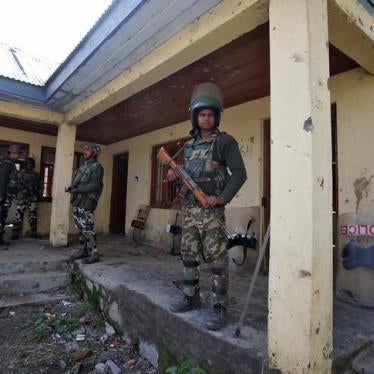 Indian police stand guard outside a polling station in Srinagar, Jammu and Kashmir, on April 13, 2017. 