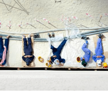 Foreign workers take a break during lunch at a building site in Kuwait City, October 21,2013. 