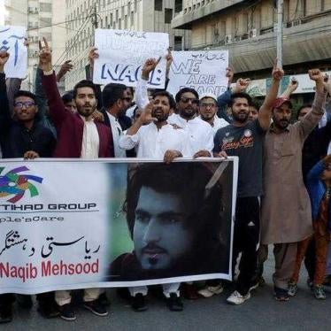 People chant slogans and hold signs as they condemn the death of Naqibullah Mehsud, whose family said he was killed by police in a so-called "encounter killing", during a protest in Karachi, Pakistan January 21, 2018.