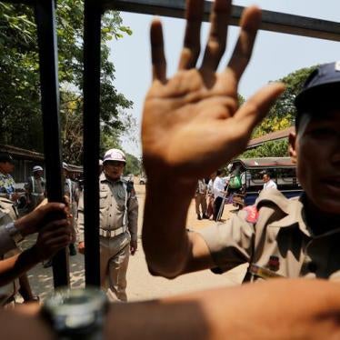 Police officers guard in front of Insein prison while prisoners walk out, who are part of the over 8,000 inmates released to mark Myanmar’s new year amnesty announced by Myanmar's President Win Myint, in Yangon, Myanmar April 17, 2018. REUTERS/Ann Wang
