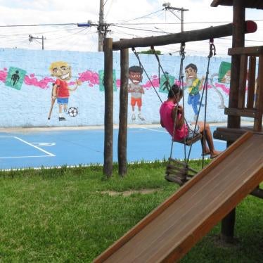 A girl with a disability in the walled yard of an institution for people with disabilities in Rio de Janeiro.