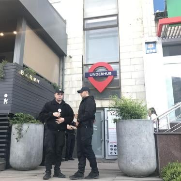 Kyiv police waiting outside the venue where an Amnesty International event was disrupted by members of radical groups.