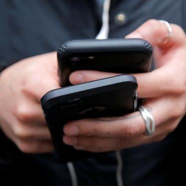 A woman uses her cell phones in Manhattan, New York, U.S., January 30, 2018.