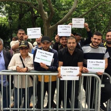 Street Vendors who work near the World Trade Center stand outside of New York's City Hall to oppose proposed legislation that would result in their displacement.  