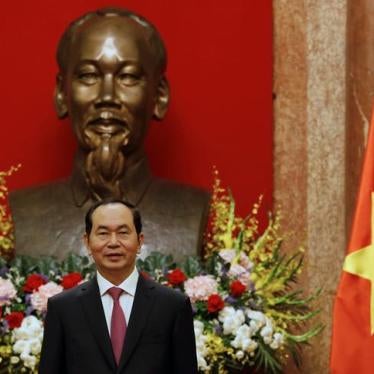 Vietnam's President Tran Dai Quang stands in front of a statue of late Vietnamese revolutionary leader Ho Chi Minh while he waits for arrival of Russia's Defence Minister Sergei Shoigu (not pictured) in Hanoi, Vietnam January 23, 2018. REUTERS/Kham