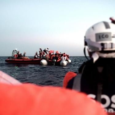 SOS MEDITERRANEE crew rescue people off an over-crowded rubber boat in the Mediterranean, June 9, 2018. 