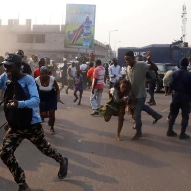 Supporters of Congolese opposition leader Jean-Pierre Bemba run to take cover after riot police fired teargas to disperse them in downtown Kinshasa, Democratic Republic of Congo, August 1, 2018.