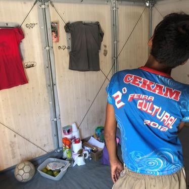 Pedro M., 12, inside the housing unit where he lives with his sister Mariana, 13, at a UN shelter in Roraima in October 2019. Photo by César Muñoz 