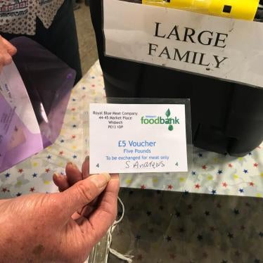 Volunteers at the Wisbech food bank, Cambridgeshire make up an emergency parcel suitable for a large family, April 20. This food bank can sometimes offer families with children an additional £5 voucher to be redeemed at the local butcher or greengrocers. 